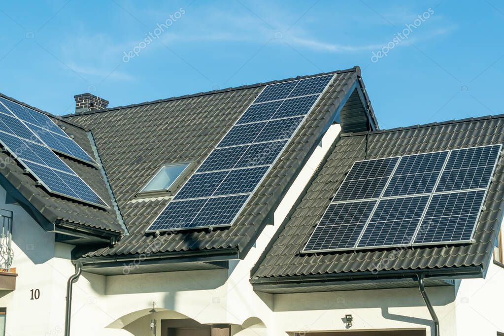 solar panels on the black roof of a single family house