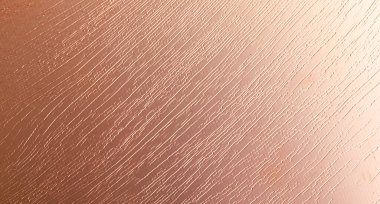 İlginç bir dokusu olan bakır bir yaprak. arkaplan