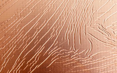 İlginç bir dokusu olan bakır bir yaprak. arkaplan