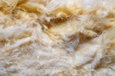 Görünür desenli sarı mineral yünü.
