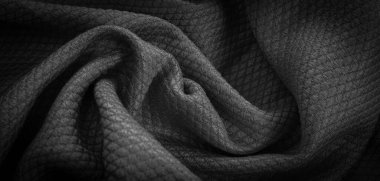 black cotton material with an interesting pattern