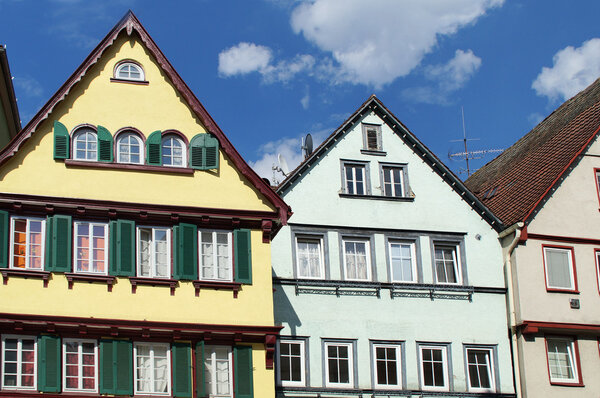 Three medieval houses. The lovingly restored half-timbered houses are plastered. Each house has different projections, bevels and oblique surfaces. A perpendicular line is rarely found in these individual houses, this makes them so unique.