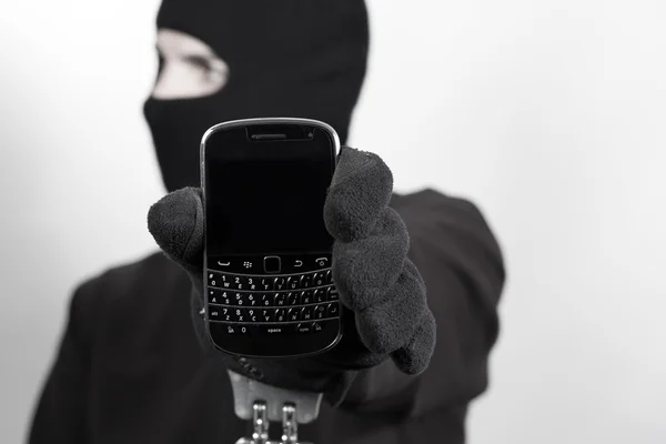 Thief with stolen smartphone — Stock Photo, Image