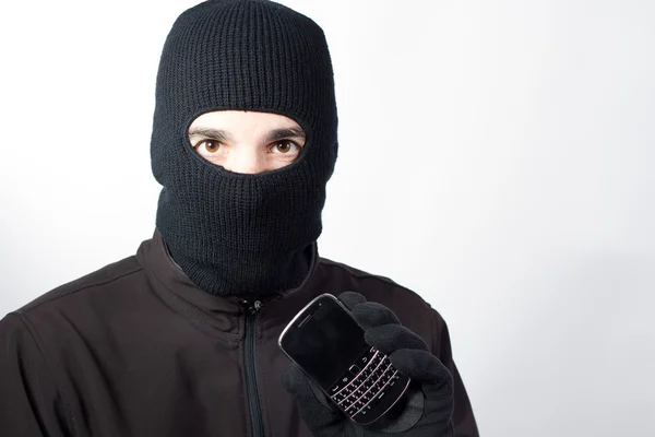 Thief with stolen smartphone — Stock Photo, Image
