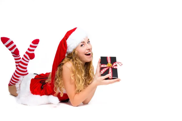 Christmas girl is happy with her present — Stock Photo, Image