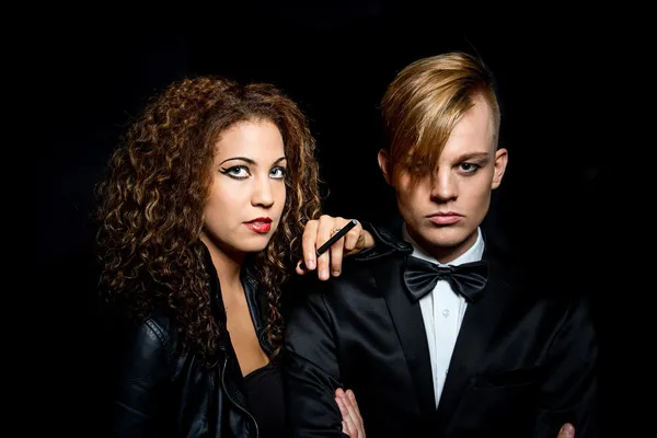 Man and woman posing in the dark — Stock Photo, Image