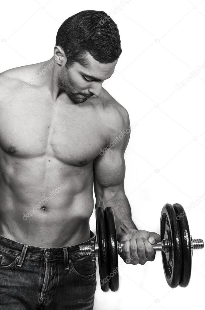 Male model with muscular body training his arms