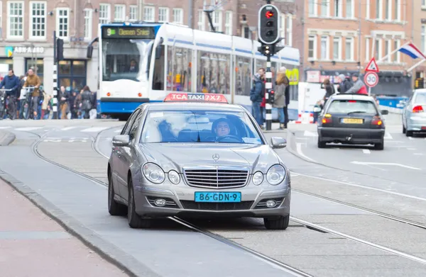 Taxi driving trough Amsterdam — Stock Photo, Image