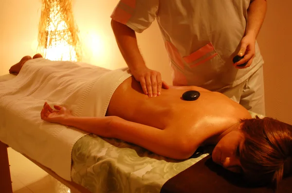 Girl laying on a massage table — Stock Photo, Image