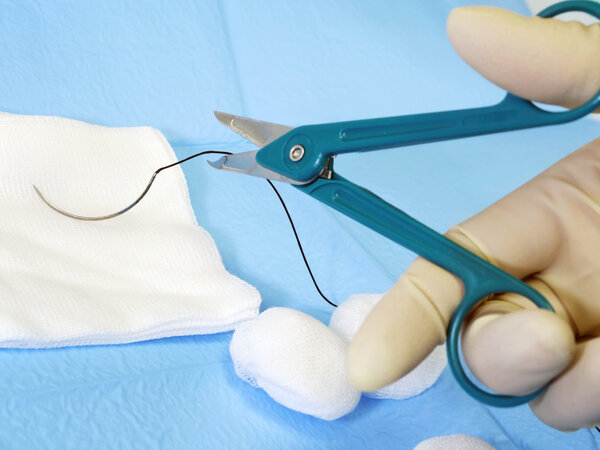 surgical scissors cutting suture thread