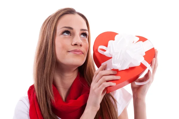 Smiling girl with gift heart — Stock Photo, Image