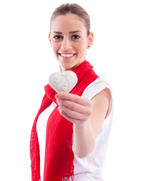 Smiling beautiful girl holding candy heart — Stock Photo, Image