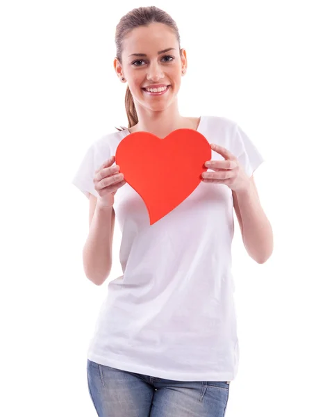 Smiling beautiful girl holding heart — Stock Photo, Image