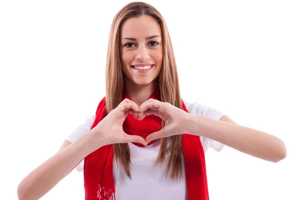 Smiling beautiful girl shows heart with hands — Stock Photo, Image