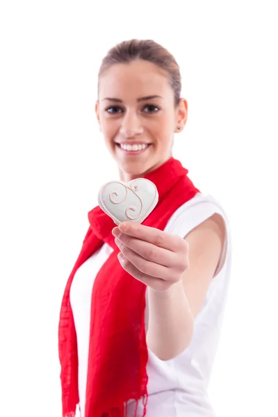 Smiling girl with candy heart — Stock Photo, Image