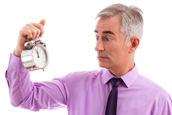 Scared businessman with clock — Stock Photo, Image