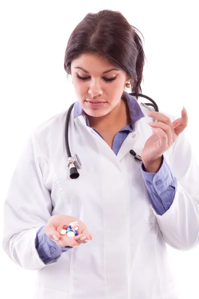 Nurse holding pills — Stock Photo, Image