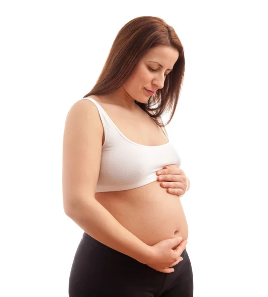 Pregnant woman holding her belly — Stock Photo, Image