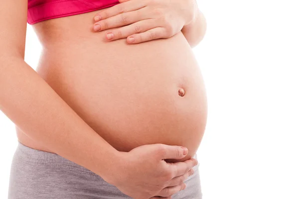 Vientre embarazado cerrar aislado — Zdjęcie stockowe