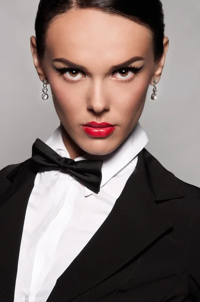 Girl in suit with bow tie — Stock Photo, Image