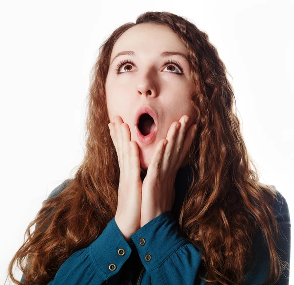 Young pretty woman looking up surprised with open mouth. — Stock Photo, Image
