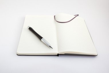 Notebook and pen on white