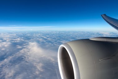 View to clouds through aircraft window clipart