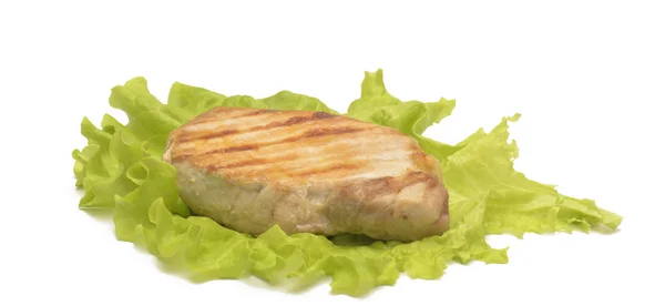 Isolated grilled meat on the leaf of salad — Stock Photo, Image