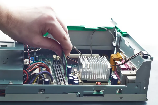 Human hand inserting RAM memory into computer during repair — Stock Photo, Image