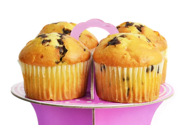 Muffins with chocolate on the stand — Stock Photo, Image