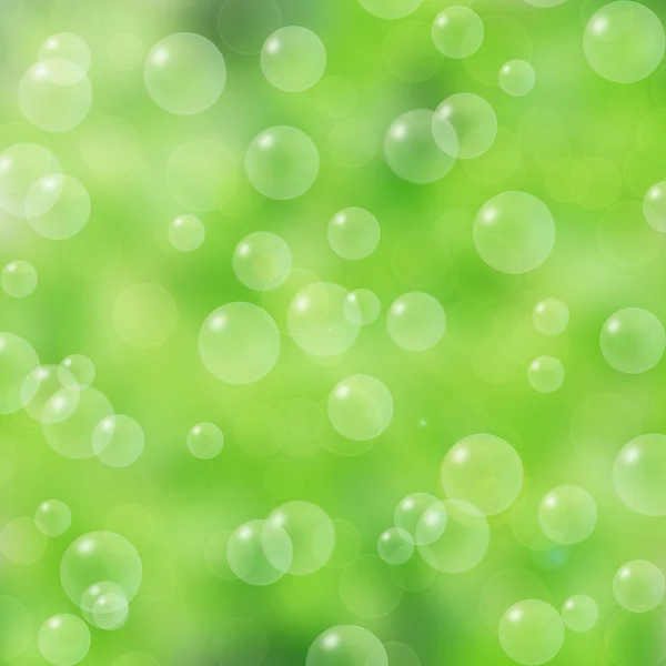 Мыльные пузыри на зеленом фоне — стоковое фото