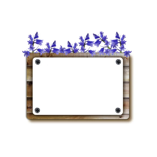 Wooden notice board with flowers — Stock Photo, Image