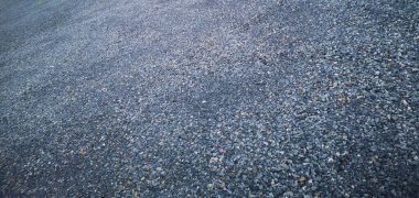 Çakıl taşlarıyla soyut bir arka plan. Plaj taşları. Kayalar.