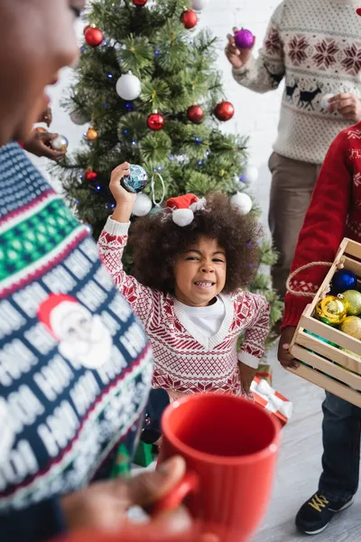 Excited African American Girl Blurred Grandmother Cup Parents Decorating Christmas — Stock Photo, Image