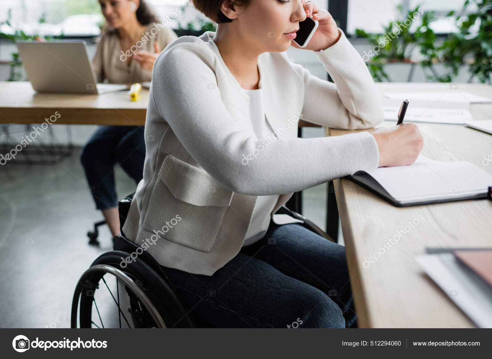 Businesswoman Disability Talking Smartphone Writing Notebook Office ...