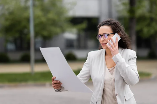 African American Businesswoman Eyeglasses Looking Papers Conversation Cellphone Outdoors — Stock Photo, Image