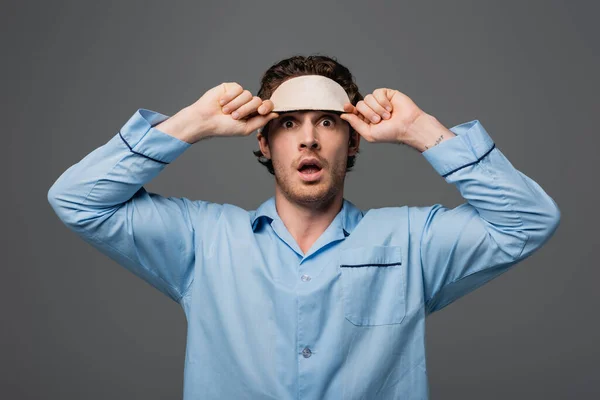 Surprised Man Pajama Holding Sleep Mask Isolated Grey — Stock Photo, Image