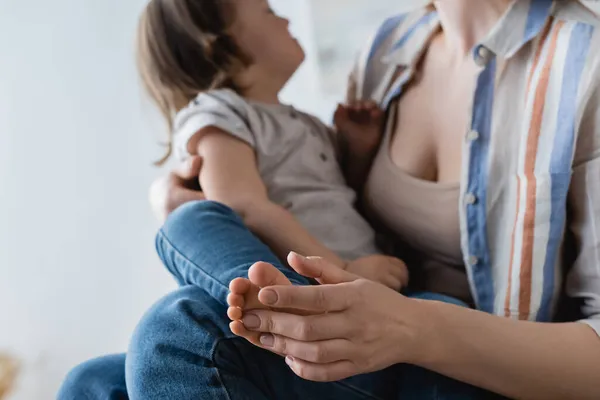 Blurred Woman Touching Leg Daughter Syndrome Home — Stock Photo, Image