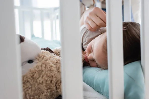 Parent Touching Sleeping Daughter Syndrome Crib Home — Stock Photo, Image