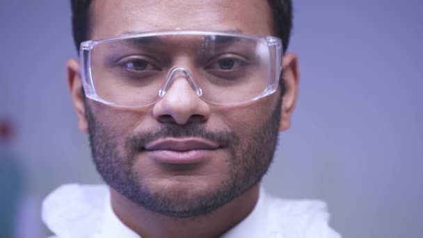 Slow Motion Indian Scientist Goggles Looking Camera Lab Stock Footage