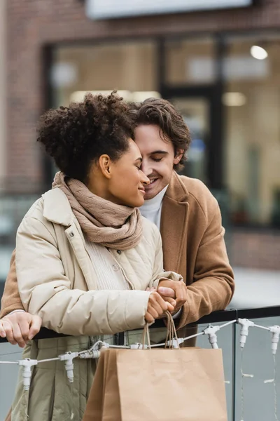 Happy Man Holding Hands Smiling African American Girlfriend Shopping Mall — Stock Photo, Image