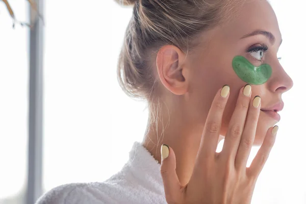 Side View Young Woman Bathrobe Applying Green Eye Patch — Stock Photo, Image