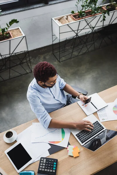 Overhead View African American Businessman Using Gadgets Documents Office — Stockfoto