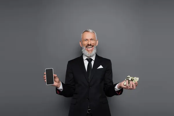 Joyful Middle Aged Businessman Holding Dollar Banknotes Smartphone Blank Screen — Stock Photo, Image