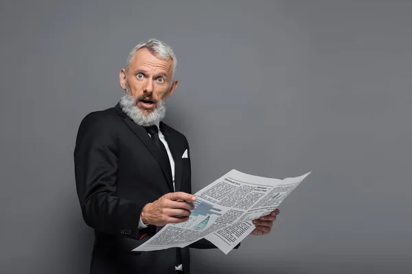 Surprised Middle Aged Businessman Holding Newspaper Grey — Stock Photo, Image
