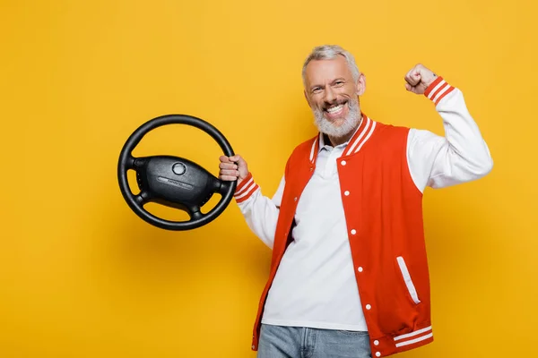 Excited Middle Aged Man Bomber Jacket Holding Steering Wheel Yellow — Stock Photo, Image