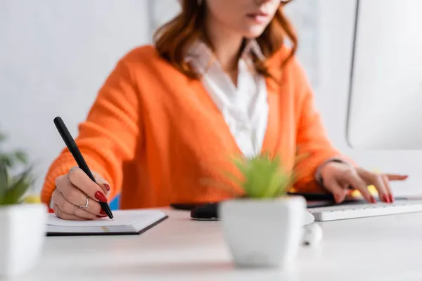 Cropped View Blurred Woman Writing Notebook Typing Keyboard Home — Stock Photo, Image