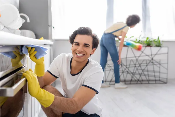 Happy Young Man Cleaning Electric Oven Rag Curly African American — Stock Photo, Image