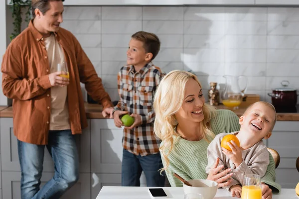 Joyful Woman Having Fun Kid Kitchen Father Talking Son Blurred — Stock Photo, Image