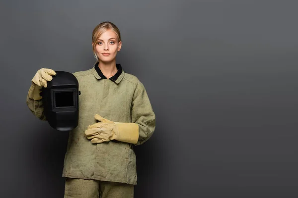 Young Blonde Welder Gloves Holding Mask Looking Camera Grey Background — Stock Photo, Image